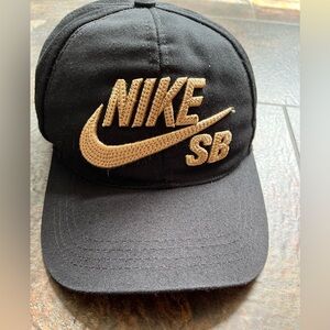 Nike SB 59FIFTY black and gold snap back cap hat.